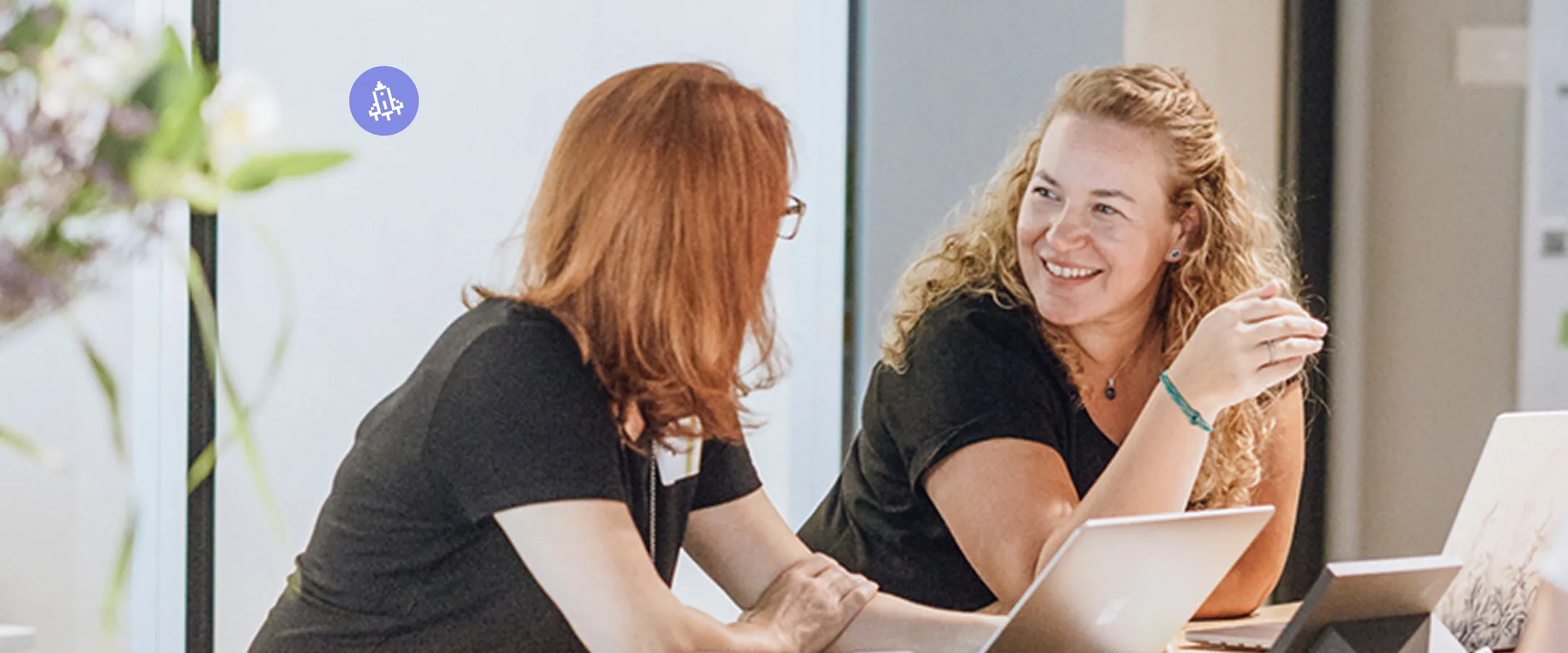 four people sitting at a table