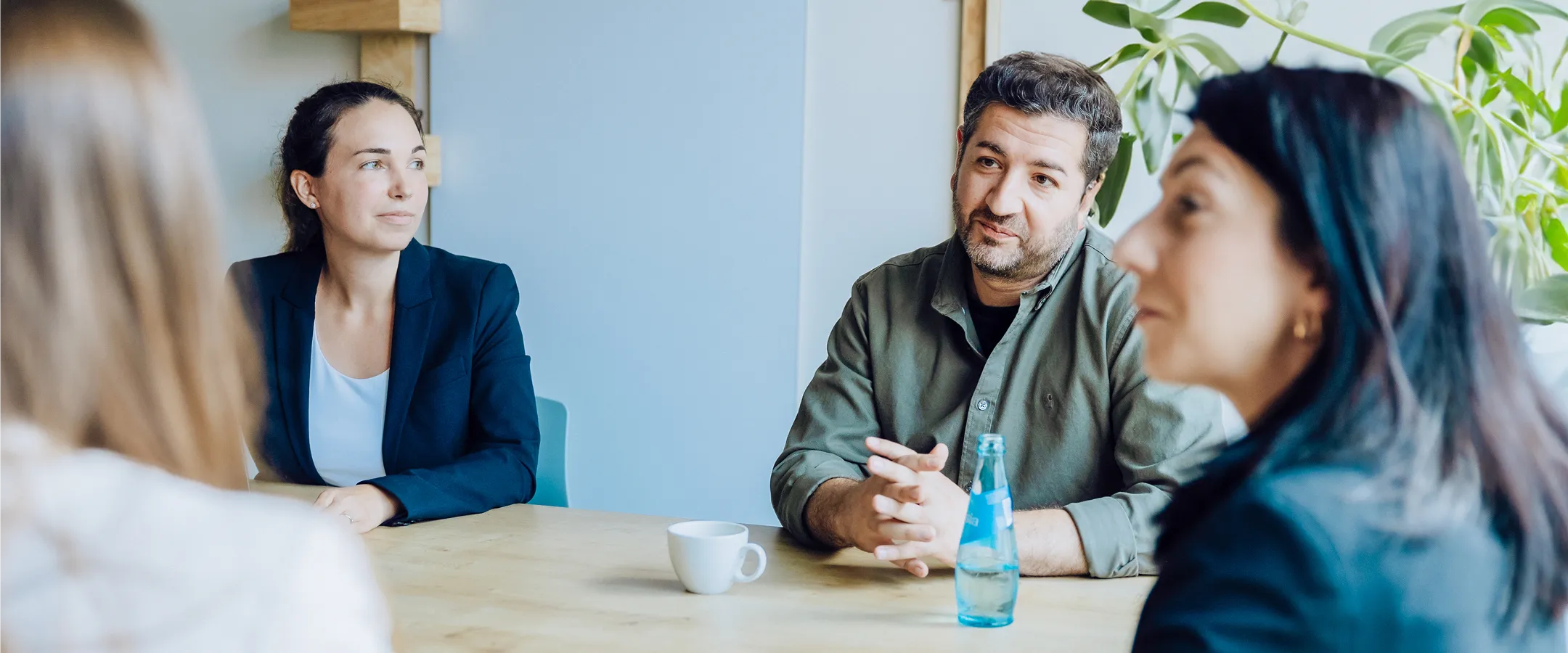 four people sitting at a table