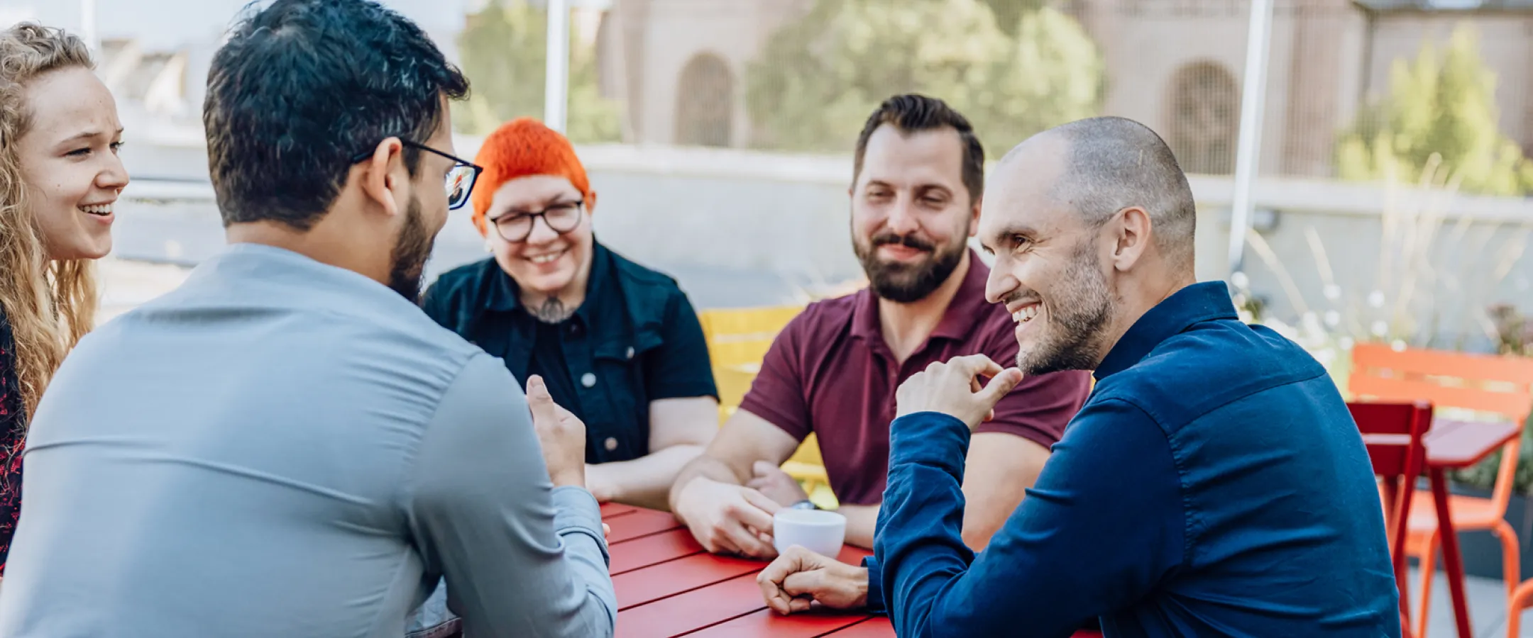 people sitting together at a table chatting