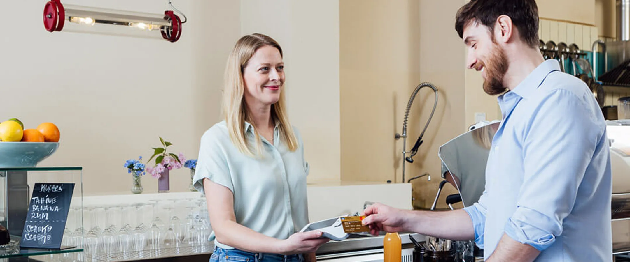 cashier accepting payment with a card reader
