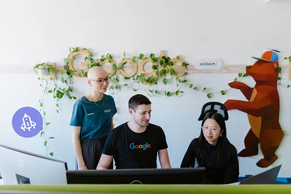 four people sitting at a table