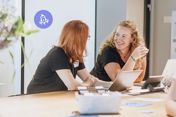 four people sitting at a table