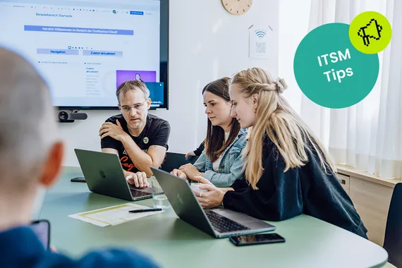IT team collaborating around a service ticket dashboard