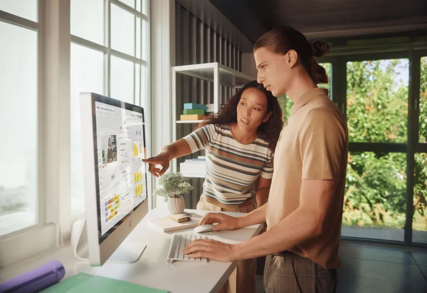two people looking at miro on a desktop computer