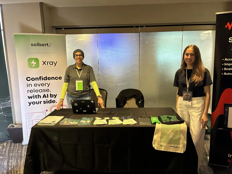 Two Seibert team members at the Seibert and Xray booth at CAST 2026