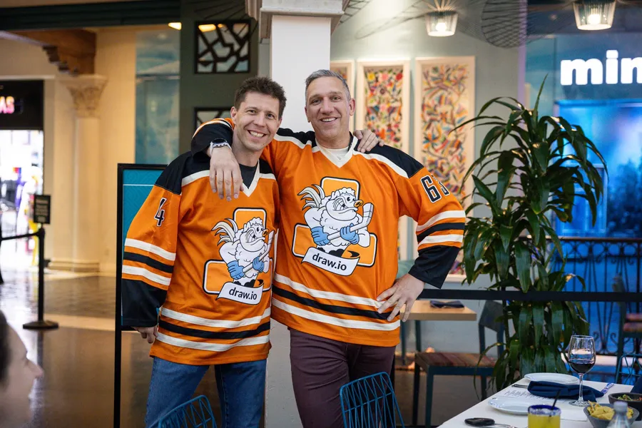 Two Seibert team members in draw.io hockey jerseys at Atlassian Team '24